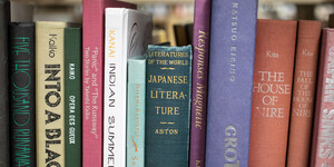 lined books on a bookshelf