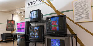 Exhibit display of six televisions playing video artworks