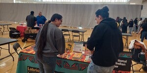 Students reviewing the Graphic novels from the Labriola Center table at ASU RECHARGE