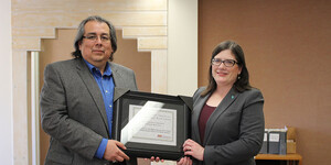 Dr. David Martinez and Sarah Deer with the plaque for Ms. Deer’s win of the Labriola Center American Indian National Book Award.