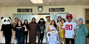 Photo of Labriola Center Staff and AISS Staff dressed up for Halloween