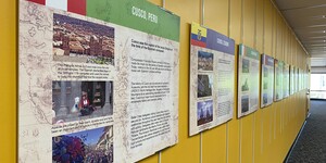 Exhibit panels featuring photos and text on a yellow