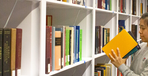 Data Analysis Specialist Tammy Dang shelves books on the 4th floor of the newly renovated Hayden Library in preparation for the re-opening in January 2020.Photo by Kelsey Hinesley/ASU Library.