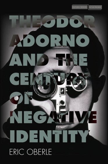 man holding a camera with text: "Theodor Adorno and the Century of Negatvie Identity"