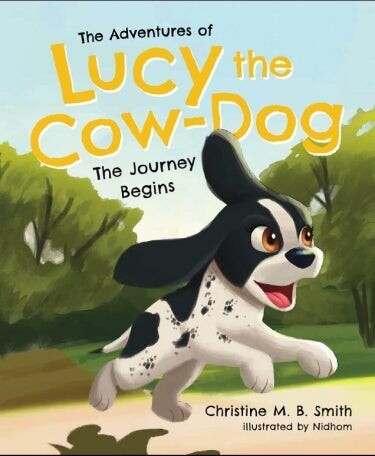 Book cover of "The Adventures of Lucy the Cow-Dog" with an illustration of a dog running on it