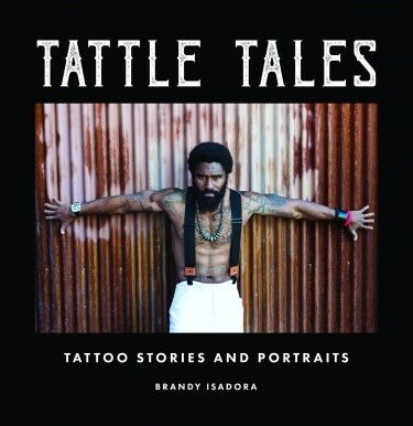 man posing on book cover in tattoos