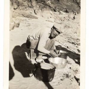 Preparing dinner at Travertine Canyon [Nov. 1937]