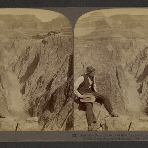 Sepia stereo card of a man sitting on a rock with printed annotation, "(12) Down the Granite Gorge of the Colorado (1,200 feet deep) from Peritese Point, Grand Canyon of Arizona. Copyright 1903 by Underwood & Underwood."