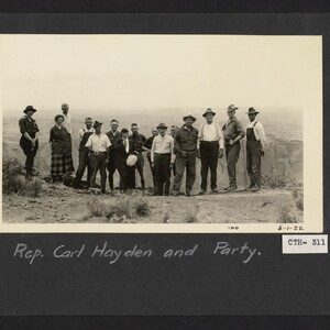 Carl Hayden's party of three women and 12 men pose on the edge of the Grand Canyon.