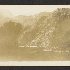 Black and white print of horse and cabins at the base of the canyon, possibly Phantom Ranch.