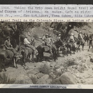 Mounted black and white photograph with a typescript annotation that reads, "July 17 1914. Making the trip down Bright Angel trail at the Grand Canyon of Arizona on mules. Left to right: George H. N. Luhrs, Jr., unknown, George H. N. Luhrs, Emma Luhrs, Ella Luhrs. Bright Angel Trail to the Colorado River, at bottom on canyon".