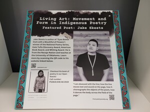 Multi-colored cardboard sign with a biography of Jake Skeets, a Navajo poet. 
