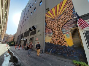 Director Alex Soto (left) and Thomas "Breeze" Marcus (right) in alleyway beside Breeze's mural of Phoenix near Cartel Coffee shop in downtown Phoenix.