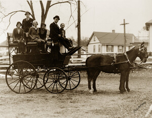 Image of people in a carriage