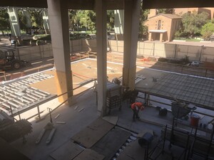 Photo from inside level 2 of Hayden Library looking out, showing the progress being made to enclose the moat on the south west corner of the building.