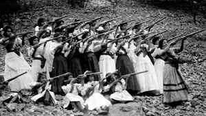 A group of rebel women and girls wearing traditional dress practice their shooting skills for the Mexican Revolution in 1911./Library of Congress; An image that wasn’t taught and shown in school or any topics surrounding the Mexican Revolution