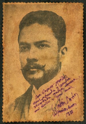 An archival photograph of Rubén Darío, a Nicaraguan man with a mustache, words are handwritten in Spanish on the bottom right.