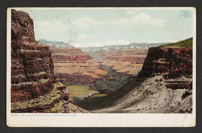 Hand colored postcard showing the Grand Canyon and bearing the number 6326 and the caption 'Grand Canyon of Arizona from Jacobs Ladder'. It also bears an oval blue stamp at the top right 'Copyright 1902 by Detroit Photographic Company.'