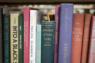 lined books on a bookshelf