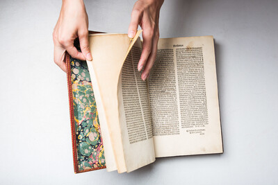 picture of hand turning a page in a book
