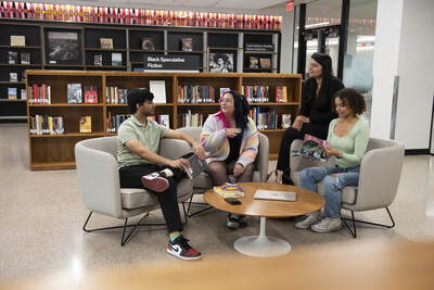 Group of students sitting in a library reading room