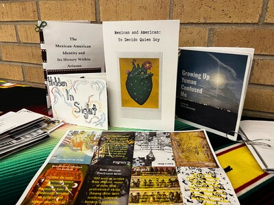A selection of handmade zines displayed on a table