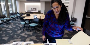 Portrait of Jessica Salow reviewing archival materials
