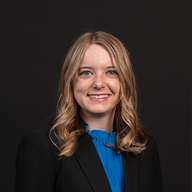 Photo of Sara Williams. She has blonde hair that ends in curls and is smiling. 